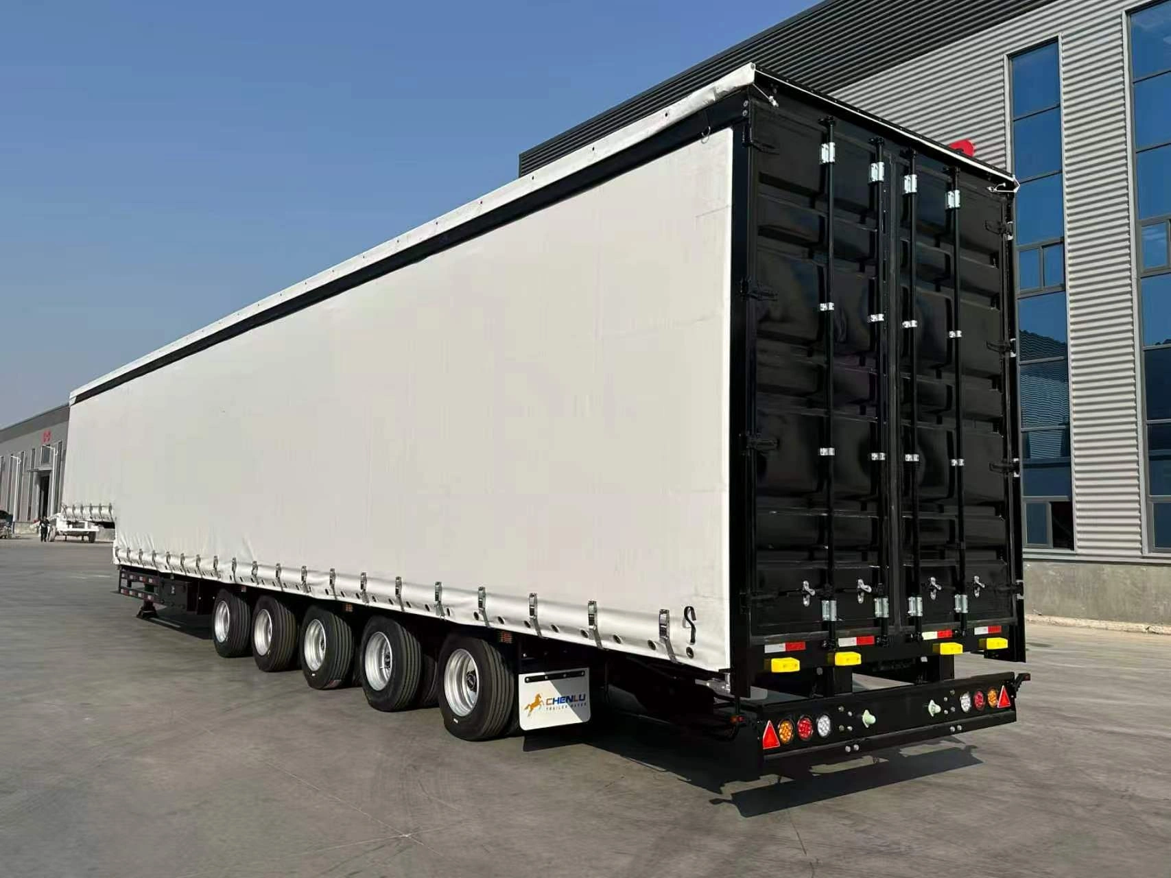 White curtain body and black double rear doors on the 5 axle curtain side trailer